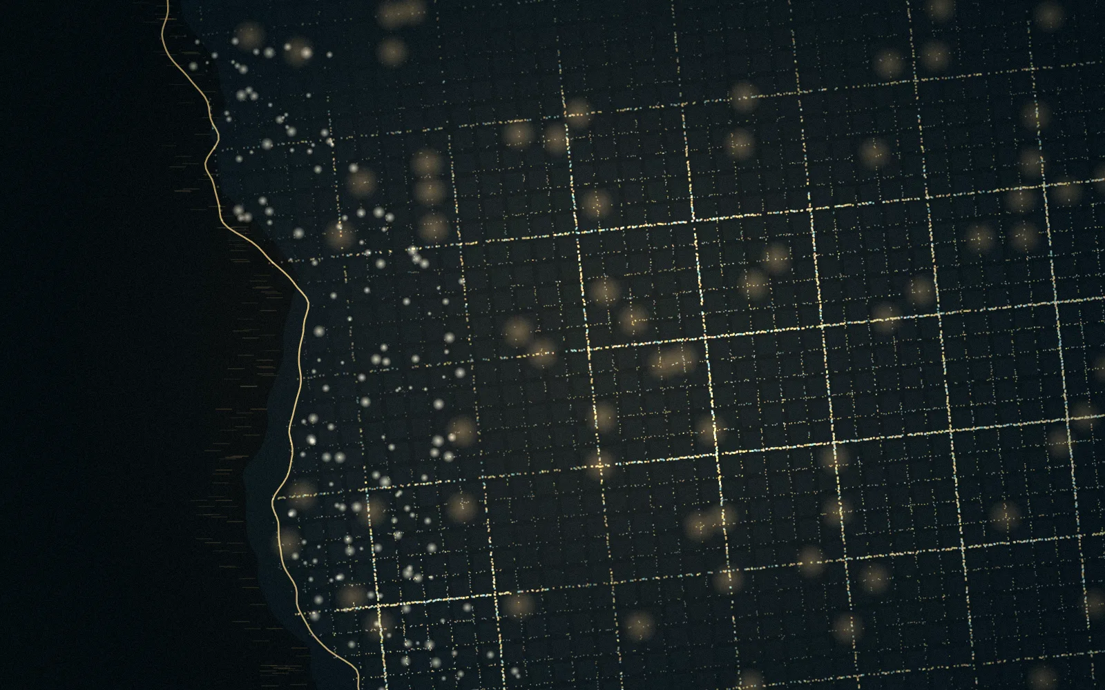 A coastal city at night, its streets lit in a grid